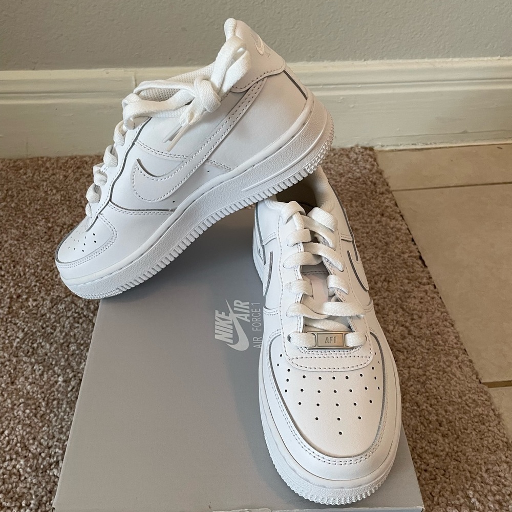 New in box. All white Airforce 1 Nike shoe. Size 4 youth or women’s size 6
